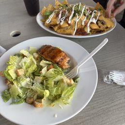 Salmon and Caesar salad and nachos Salmon and Caesar salad and nachos