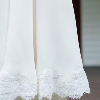 Mario Ramo Couture - 30 year old scalloped lace we added to the dress hem, sides and back - Sewing & Alterations Near Me - New Hyde Park, New York