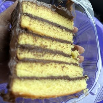 Cococakes By Coco - a hand holding a piece of cake - Bakeries Near Me - Atlanta, Georgia Cococakes By Coco - a hand holding a piece of cake - Bakeries Near Me - Atlanta, Georgia