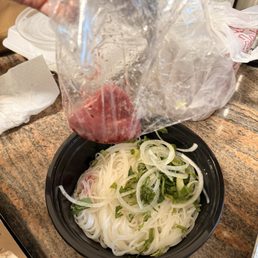 WTH is this? Two tiny slices of beef for our pho. The quality and experience here has taken a nose dive over the past few months.