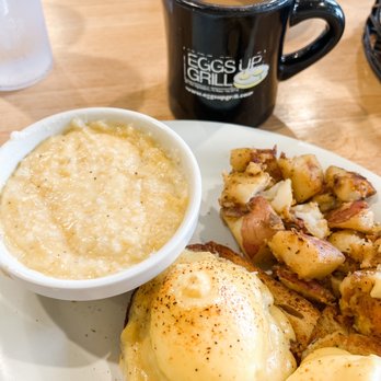 Eggs Up Grill - Crabcakes Benedict with medium poached eggs, cheese grits and roasted potatoes. - Breakfast & Brunch Near Me - Columbia, South Carolina Eggs Up Grill - Crabcakes Benedict with medium poached eggs, cheese grits and roasted potatoes. - Breakfast & Brunch Near Me - Columbia, South Carolina