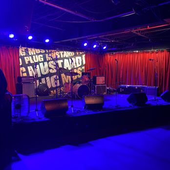 Grog Shop - a stage with a band on it - Music Venues Near Me - Cleveland, Ohio