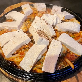 Hanshin Pocha - Spicy stir fried pork belly and Kimchee topped with tofu - Asian Fusion Near Me - Arlington Heights, Illinois Hanshin Pocha - Spicy stir fried pork belly and Kimchee topped with tofu - Asian Fusion Near Me - Arlington Heights, Illinois