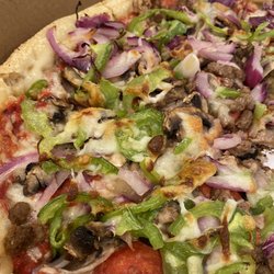 The Greek Pizzeria and Gyros - Johnny's special. Focaccia like consistency crust with fresh vegetables and 3 types of meats.