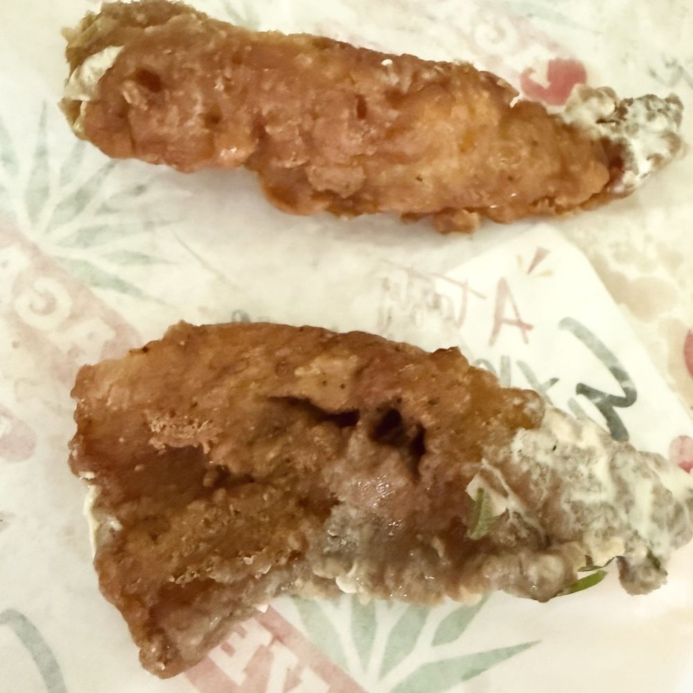 Only 2 pieces of overly fried and hard fish in the Fish Battered Burrito Only 2 pieces of overly fried and hard fish in the Fish Battered Burrito