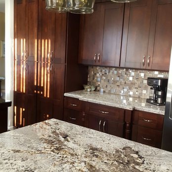 1st Choice Construction Services - a kitchen with granite countertops - General Contractors Near Me
