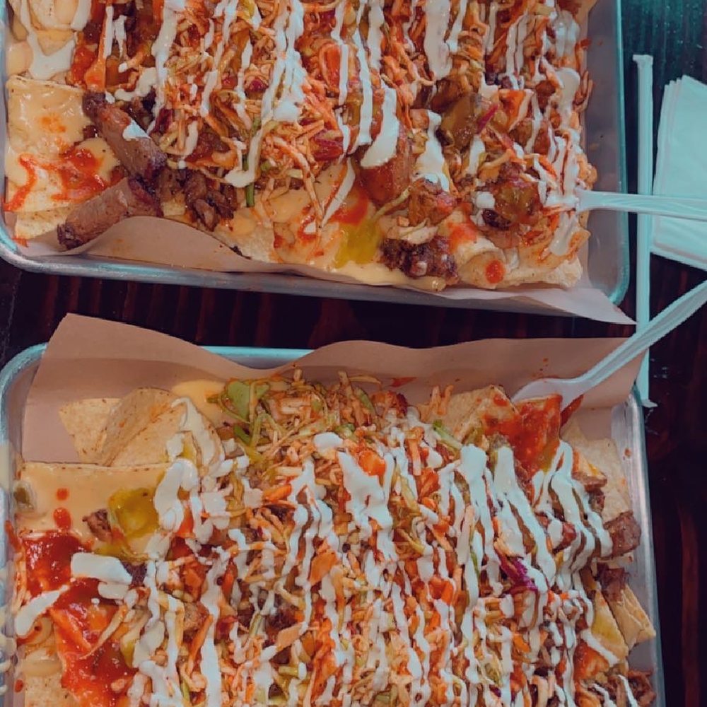 The "works"on half brisket half chicken nachos The "works"on half brisket half chicken nachos
