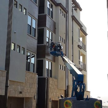 Dynasty Window Cleaning - Boom work on this Newly developed 12 unit condominium complex. Making sure the windows are spotless. Safety First boom truck certified - Window Washing Near Me - Chula Vista, California
