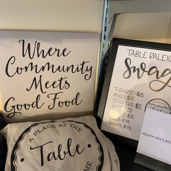 A Place At The Table - Love the merch table too. Who can't get behind pouring into your community? - Cafes Near Me - Raleigh, North Carolina A Place At The Table - Love the merch table too. Who can't get behind pouring into your community? - Cafes Near Me - Raleigh, North Carolina