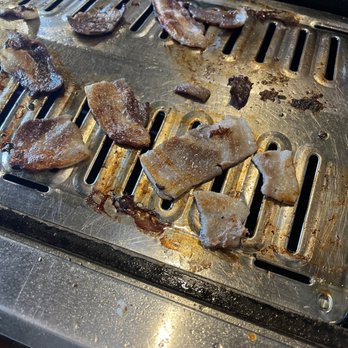 Dae Gee Korean Bbq - the meat being cooked on the grill - Korean Near Me - Aurora, Colorado