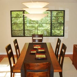 Lewis & Kladder - Dining room updated with lighting chairs and a custom rug.