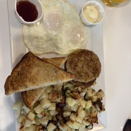 Regular breakfast plate. Over easy eggs. Sourdough. Chicken maple sausage and home fries. Regular breakfast plate. Over easy eggs. Sourdough. Chicken maple sausage and home fries.