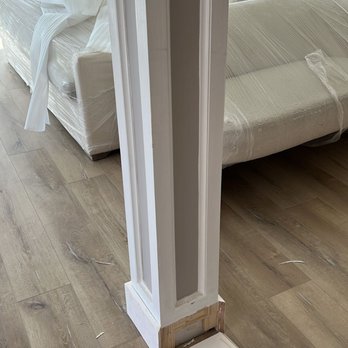 Rustic Floors - a bedroom with a bed and a window - Flooring Near Me