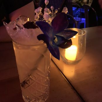 215 speakeasy - a glass with a flower in it - Cocktail Bars Near Me - West Palm Beach, Florida