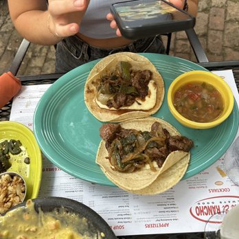 Matt's El Rancho - Asadero Tacos with Grilled Jalapenos and Grilled Garlic (seen on the green plate to the left) - Mexican Near Me - Austin, Texas Matt's El Rancho - Asadero Tacos with Grilled Jalapenos and Grilled Garlic (seen on the green plate to the left) - Mexican Near Me - Austin, Texas