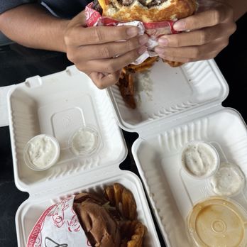 Jolene's - Ewa Beach - Hammah Burger with the cheese pull + waffle fries + ranch on the right!  Single Buttah Burger + waffle fries + ranch on the left! - Burgers Near Me - Ewa Beach, Hawaii