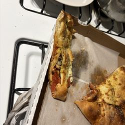 Janos Pizza - This is supposed to be a calzone from Jano's Pizza and Alpine? Worst calzone I've ever seen!