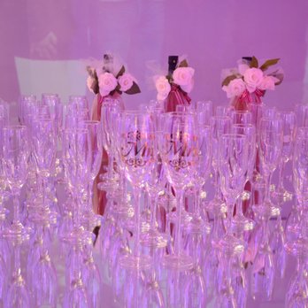 Iram's Reception Hall - Not all 60 glasses were set out. Champagne bottles seen behind glasses. - Venues & Event Spaces Near Me - Pasadena, Texas