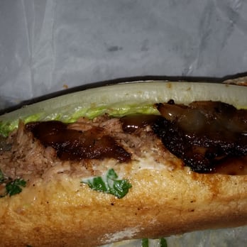Paseo - Close up of the Carribean Roast sandwich. - Caribbean Near Me - Seattle, Washington Paseo - Close up of the Carribean Roast sandwich. - Caribbean Near Me - Seattle, Washington