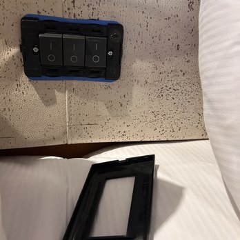 Margaritaville at Sea - Light panel cover which popped off easily off of headboard light switch on day 1 - Travel Services Near Me - Riviera Beach, Florida Margaritaville at Sea - Light panel cover which popped off easily off of headboard light switch on day 1 - Travel Services Near Me - Riviera Beach, Florida