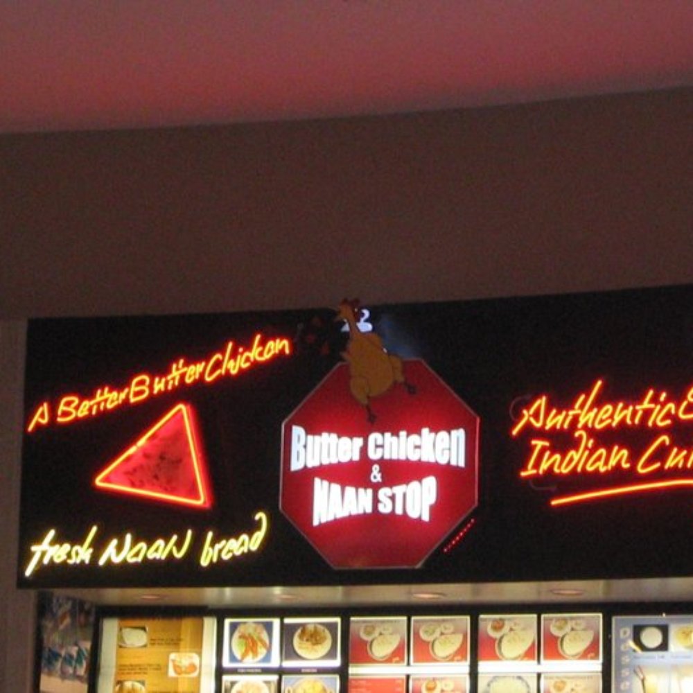 Butter Chicken and Naan Stop - a sign for butter chicken and naan stop - Indian Near Me - Edmonton, Alberta