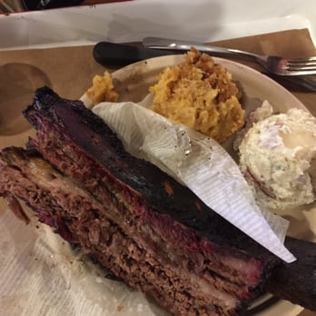 Stiles Switch BBQ & Brew - Beef rib - it is as large as it looks. The golden yellow heap is corn casserole. - Barbeque Near Me - Austin, Texas