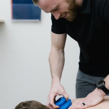 Tune Chiropractic - Dr. Gavin providing cupping therapy - Chiropractors Near Me - Eagle, Idaho Tune Chiropractic - Dr. Gavin providing cupping therapy - Chiropractors Near Me - Eagle, Idaho