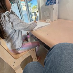 Kimberly Truong - It's important that the desk fits the students when learning to write-- and I'm always right in the little chair next to them!