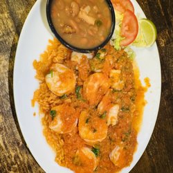 Tio Gordos Texican Cafe - "Shrimp Acapulco" delicious garlic butter grilled shrimp served with our red salsa- served on a bed of rice with Charro Beans and limes.