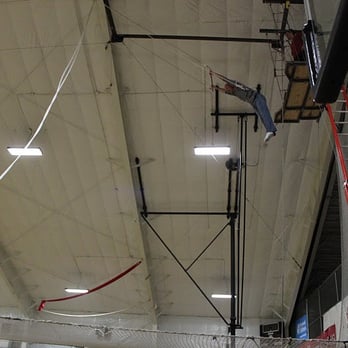 Cincinnati Circus Company - A co-worker taking off on the flying trapeze. - Event Planning & Services Near Me - Cincinnati, Ohio