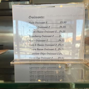Joker's Koffee - menu for food - A menu displaying different croissant options with prices, including almond, cream cheese, strawberry, apple, ham & cheese, cheese bacon, chocolate chips, and bacon egg croissants. - Coffee & Tea Near Me - Arcadia, California