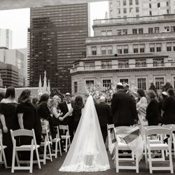 Tropical Spice Event Rentals - Manhattan wedding ceremony setup featuring our white garden chair rentals.