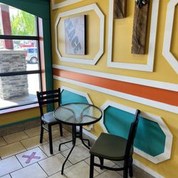 Pizza Mia - Some limited seating inside. 2 tables and 4 chairs.