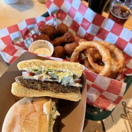 Veggie burger, onion rings, and fried mushrooms Veggie burger, onion rings, and fried mushrooms