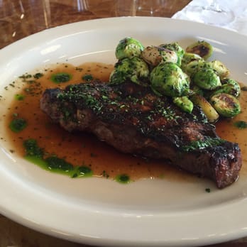 Nana Steak - NY Strip with roasted Brussels sprouts and onions - Steakhouses Near Me - Durham, North Carolina
