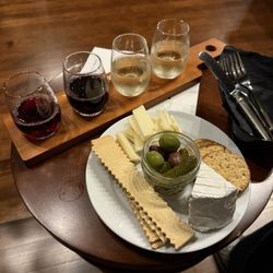 Sitka Wine Lounge - Flight of wine & bubbly (YUM!) and their cheese board. Perfect amount for two people. Nice vibe too!