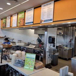 QDOBA Mexican Eats - Kitchen and order counter.