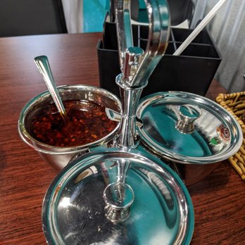 Pho Viet Cincy - Every table has chili oil, dried chili mix and vinegar. Also on the table is Sriracha, hoisin, salt/pepper and soy sauce - Vietnamese Near Me - Cincinnati, Ohio Pho Viet Cincy - Every table has chili oil, dried chili mix and vinegar. Also on the table is Sriracha, hoisin, salt/pepper and soy sauce - Vietnamese Near Me - Cincinnati, Ohio