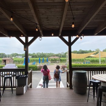 Jason's Vineyard - Wood deck overlooking outside covered patio - Wineries Near Me - Jamesport, New York Jason's Vineyard - Wood deck overlooking outside covered patio - Wineries Near Me - Jamesport, New York