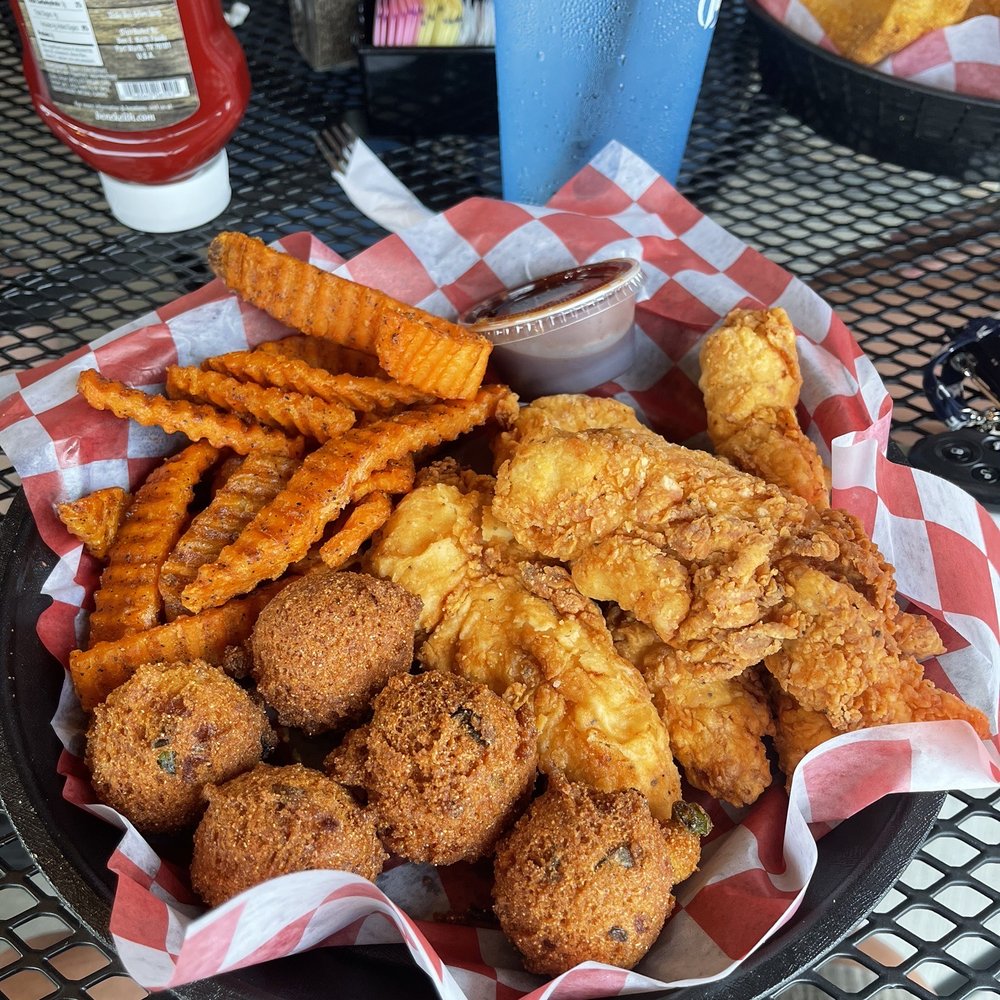 Flat Creek - Checked Basket with upcharge sweet potato fries and added hush puppies. - Steakhouses Near Me - Webb City, Missouri Flat Creek - Checked Basket with upcharge sweet potato fries and added hush puppies. - Steakhouses Near Me - Webb City, Missouri