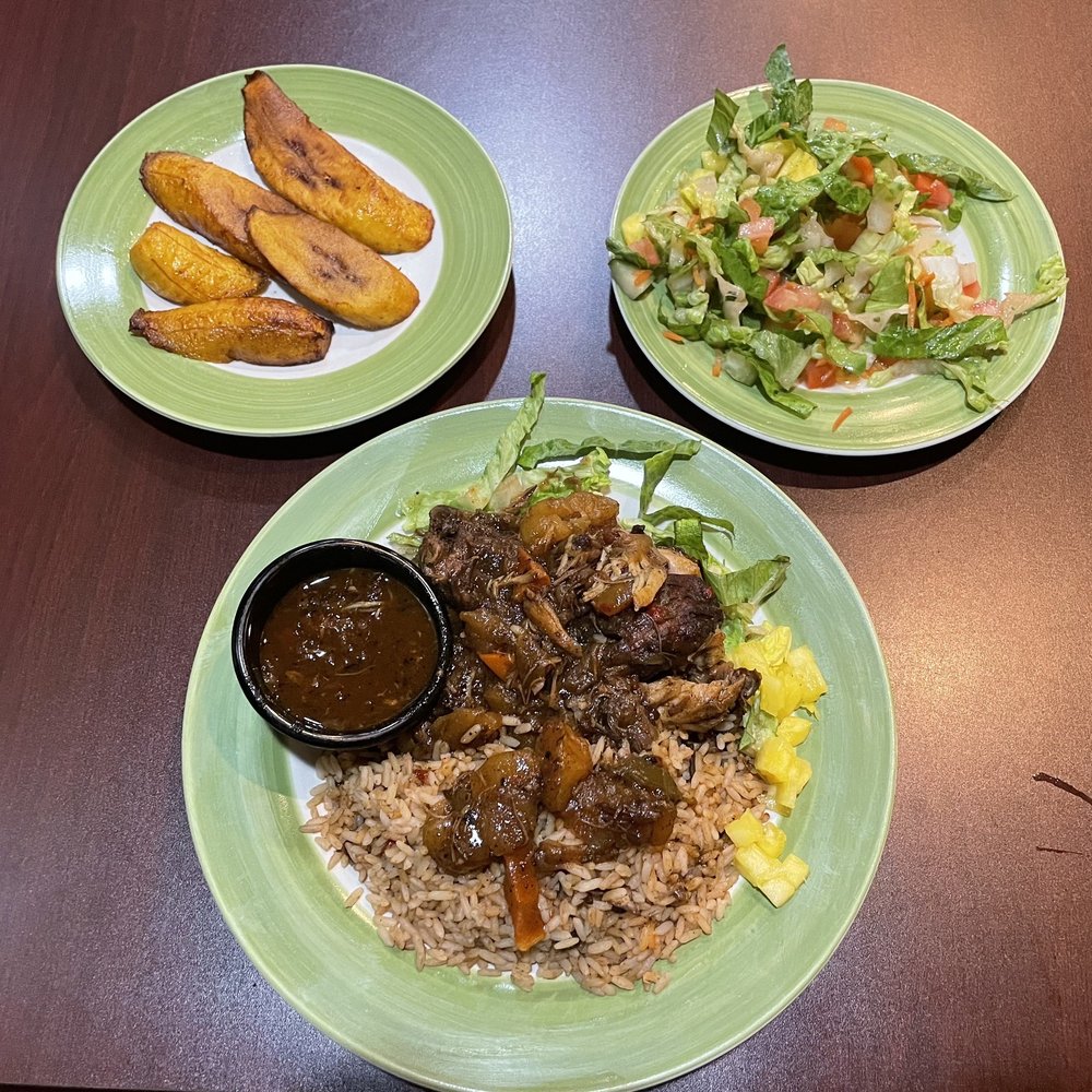 Stewed meat and vegetables with rice and beans, the side salad and caramelized plantains. Stewed meat and vegetables with rice and beans, the side salad and caramelized plantains.