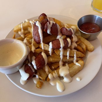 Pio Peruvian - Salchipapas with sauce - Peruvian Near Me - Calgary, Alberta