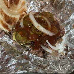 Jim Bobs Bbq - BBQ Brisket sandwich with onions, pickles, jalapeños and sauce. Chunks of very tender meat. BEST BBQ IN ROCKPORT TEXAS!!!