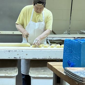 Dom Bakeries - Baker making cinnamon rolls for the next day - Bakeries Near Me - Ypsilanti, Michigan Dom Bakeries - Baker making cinnamon rolls for the next day - Bakeries Near Me - Ypsilanti, Michigan