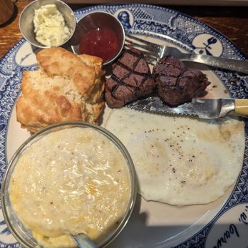 MoCo's Founding Farmers - Farmers breakfast. Medium steak. Over medium eggs, grits, biscuit - New American Near Me - Potomac, Maryland MoCo's Founding Farmers - Farmers breakfast. Medium steak. Over medium eggs, grits, biscuit - New American Near Me - Potomac, Maryland