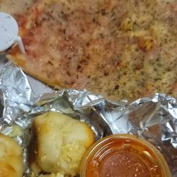 Leftover plain pizza and garlic knots with sauce