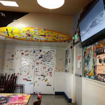 Wahoo's Fish Taco - More decor on the walls and a TV to boot - Seafood Near Me - Huntington Beach, California Wahoo's Fish Taco - More decor on the walls and a TV to boot - Seafood Near Me - Huntington Beach, California
