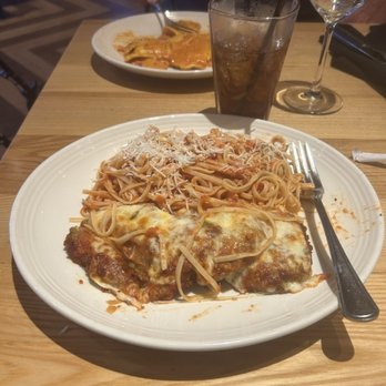 Carrabba's Italian Grill - Eggplant Parmesan with Mezzaluna in the background - Italian Near Me - Naples, Florida Carrabba's Italian Grill - Eggplant Parmesan with Mezzaluna in the background - Italian Near Me - Naples, Florida