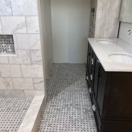 The bathroom tile and shower