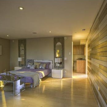 Simmons Construction - a bedroom with a large bed - General Contractors Near Me Simmons Construction - a bedroom with a large bed - General Contractors Near Me